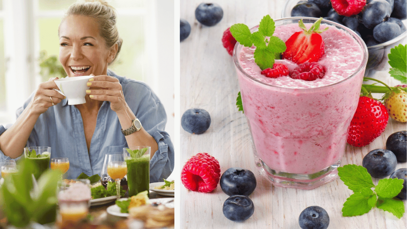Blonde Frau mit Tasse am gesund gedeckten Frühstückstisch, daneben ein roter Beerensmoothie